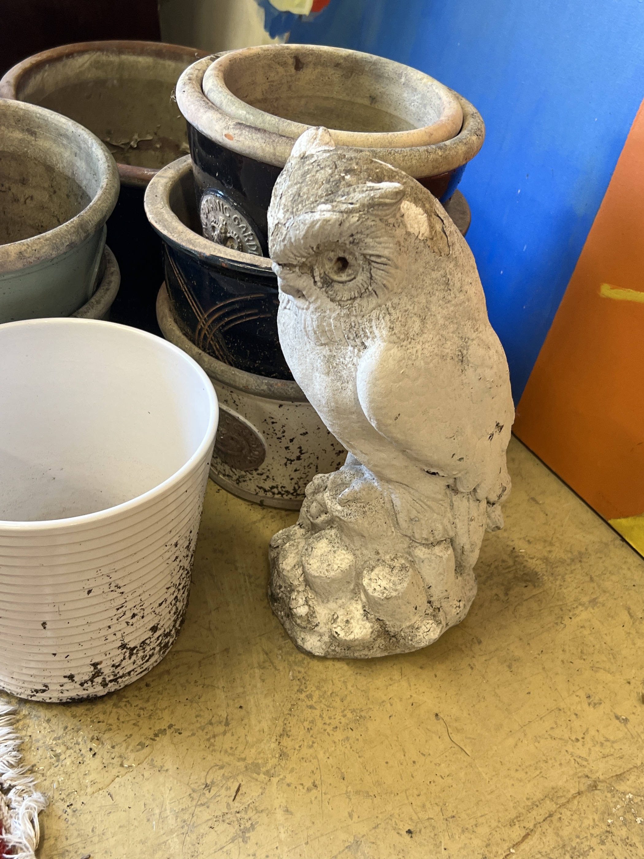 Ten assorted planters and a reconstituted stone owl garden ornament, largest width 38cm